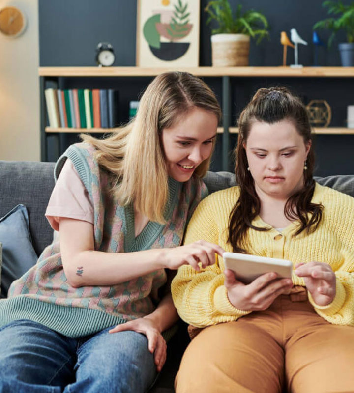 NDIS participant receiving assisted living support from caregiver